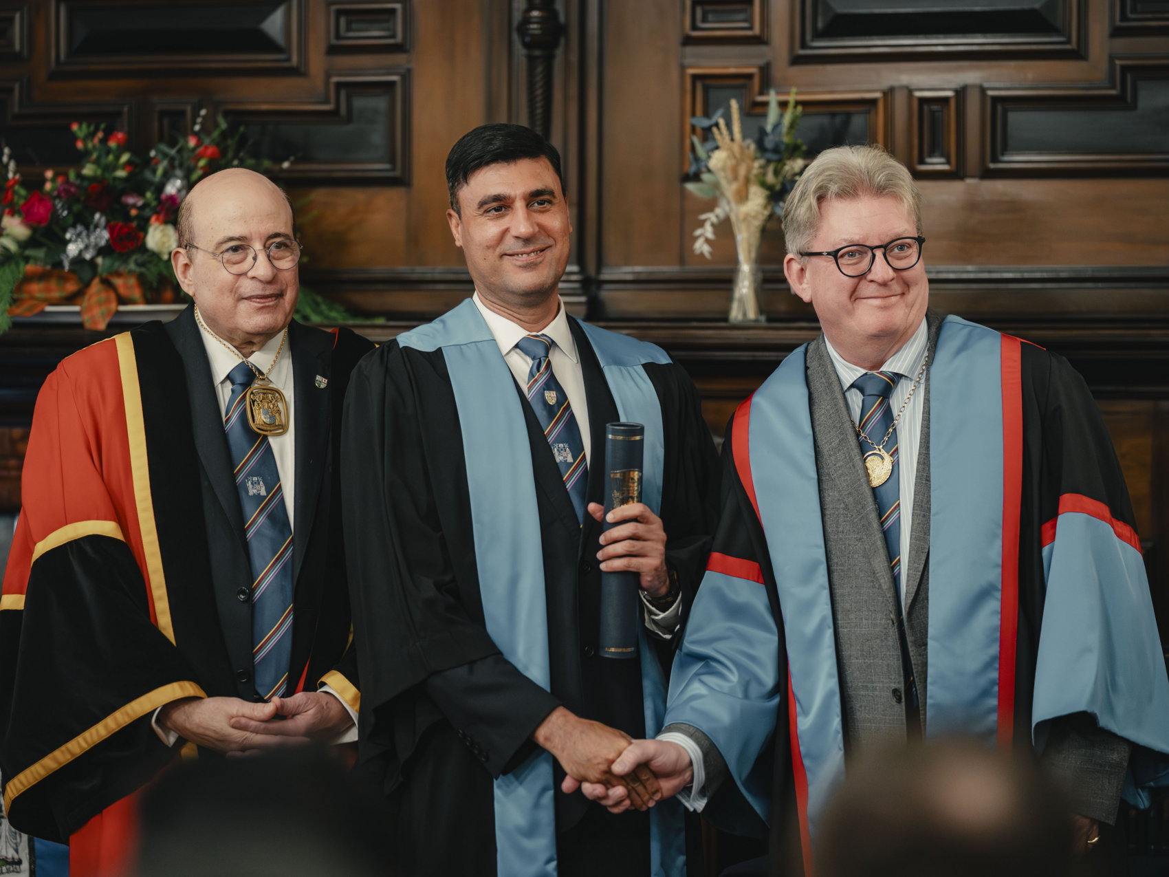 A diplomat receiving their diploma